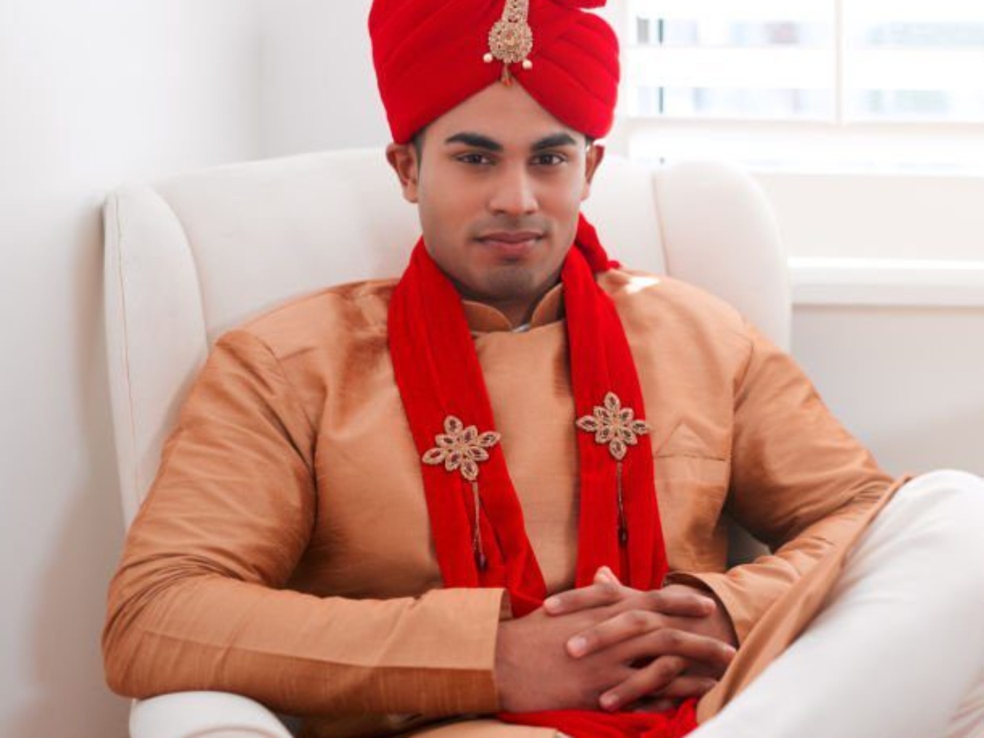 Shot of a handsome young man sitting in a chair in anticipation of his wedding